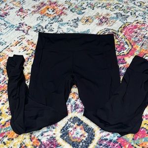 PureLuxe Fabletics black leggings, size M/L, with twist detail at the ankle